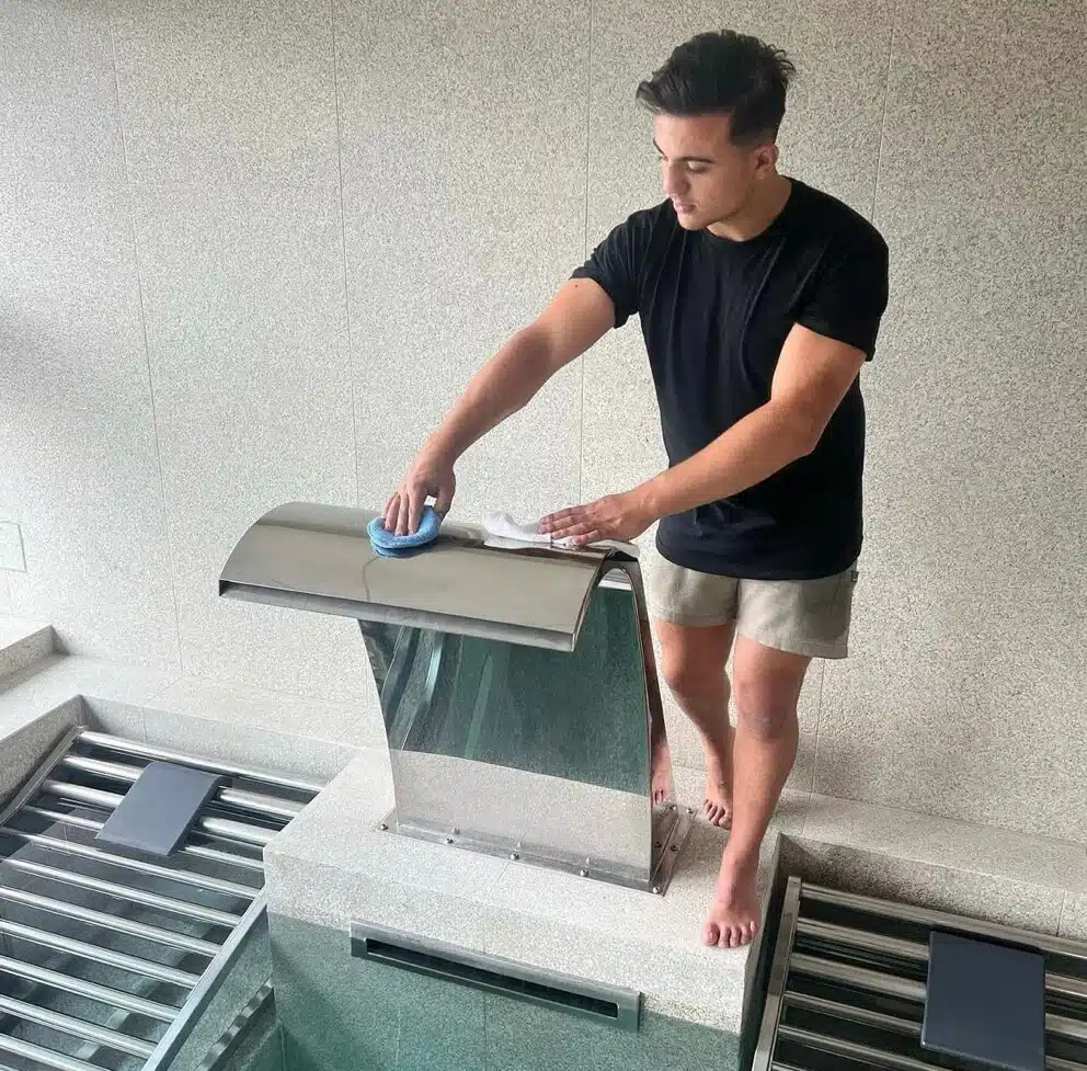 Cleaning the Ritz Calrton custom water feature with our Stainex Mirror Polish